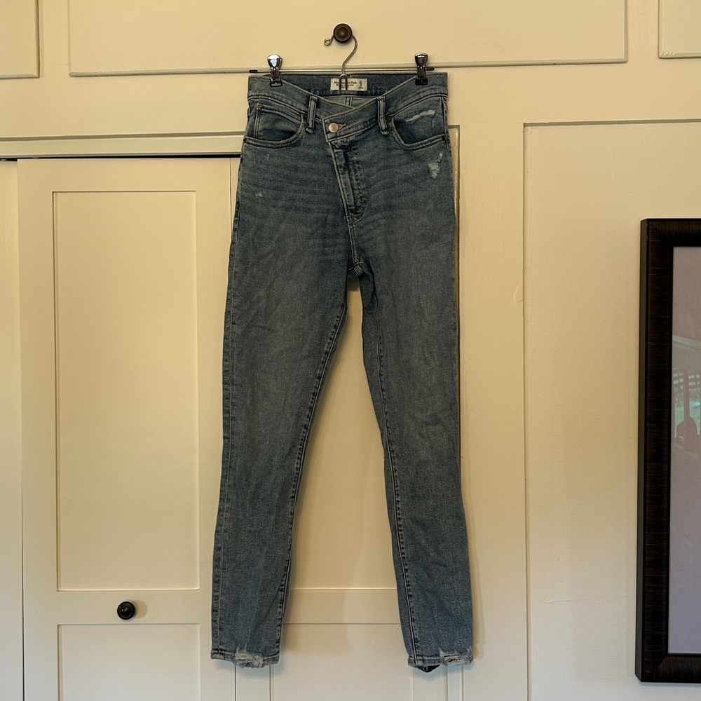 Abercrombie & Fitch The Super Skinny Ankle High Rise Cross Button Jeans